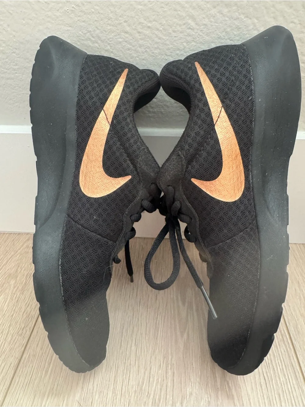 Nike womens Black Sneakers with Copper Swoosh Accent
